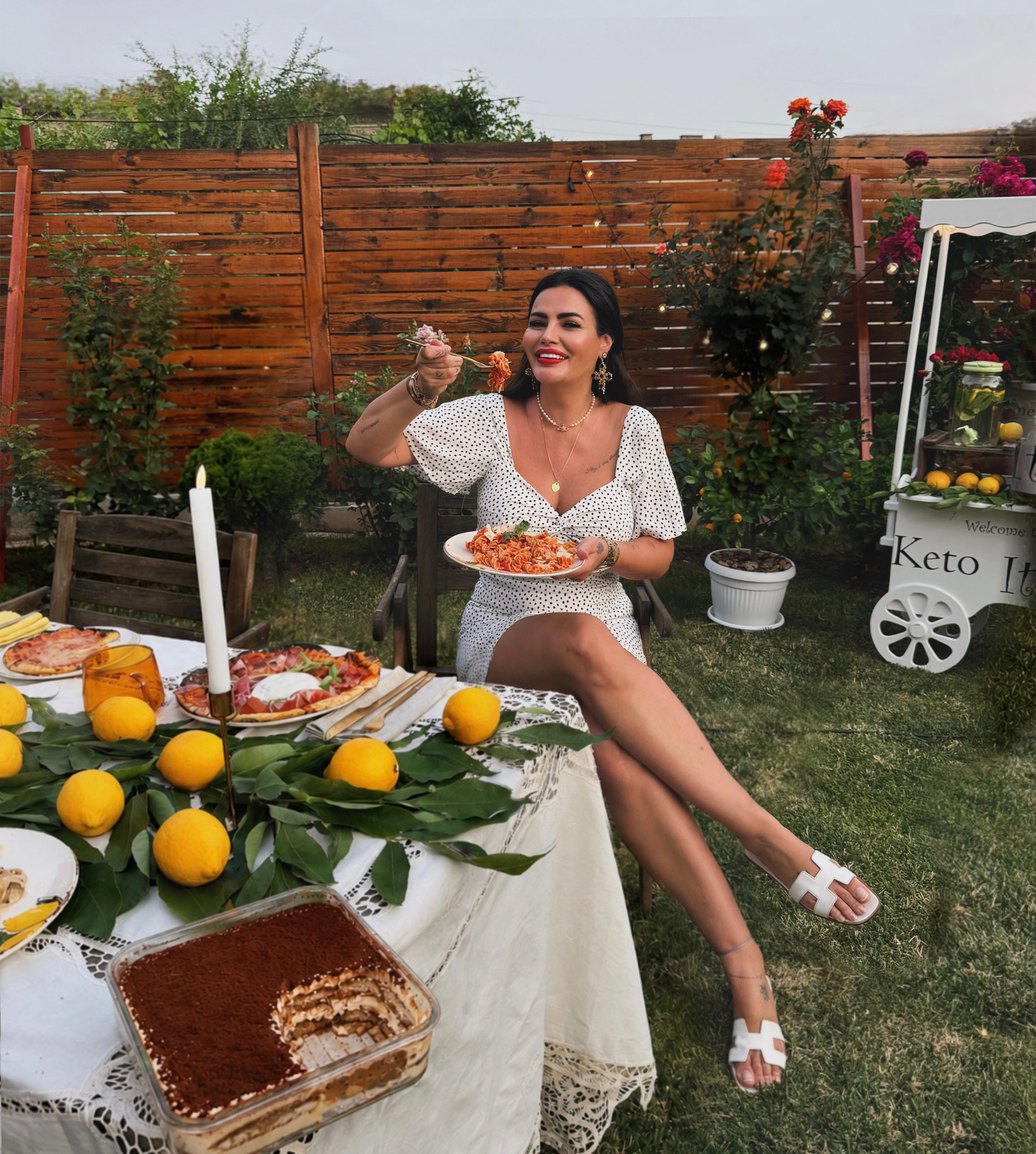 Daniela Ermenkova with keto food and desserts in a garden